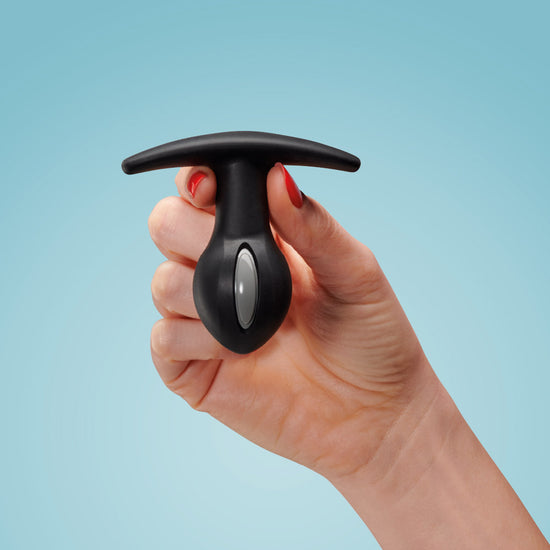 Woman's hand holding Fun Factory's B Ball Uno butt plug