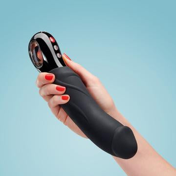 Woman's hand holding Fun Factory's Big Boss vibrator