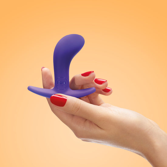 Woman's hand holding Fun Factory's Bootie butt plug