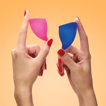 Woman's hands holding Fun Factory's menstrual Fun Cups