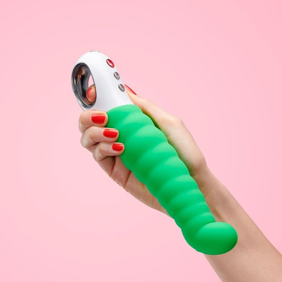 Woman's hand holding Fun Factory's Patchy Paul Vibrator