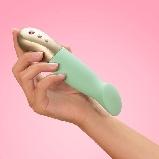 Woman's hand holding Fun Factory's Sundaze g-spot vibrator