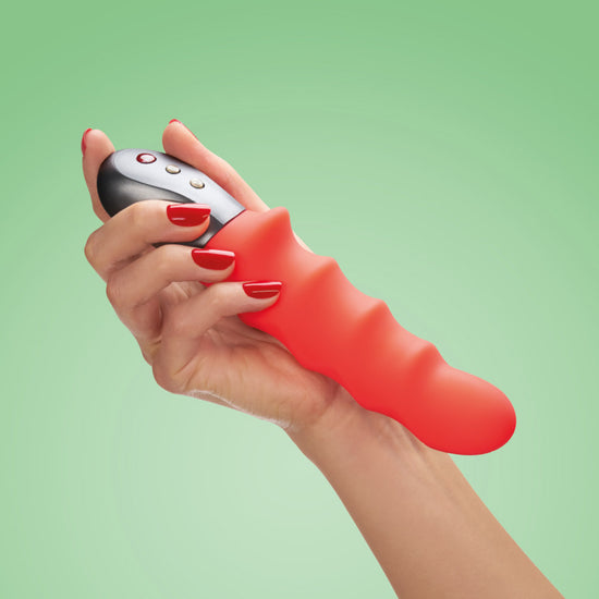 Woman's hand holding Fun Factory's Stronic Surf Pulsator